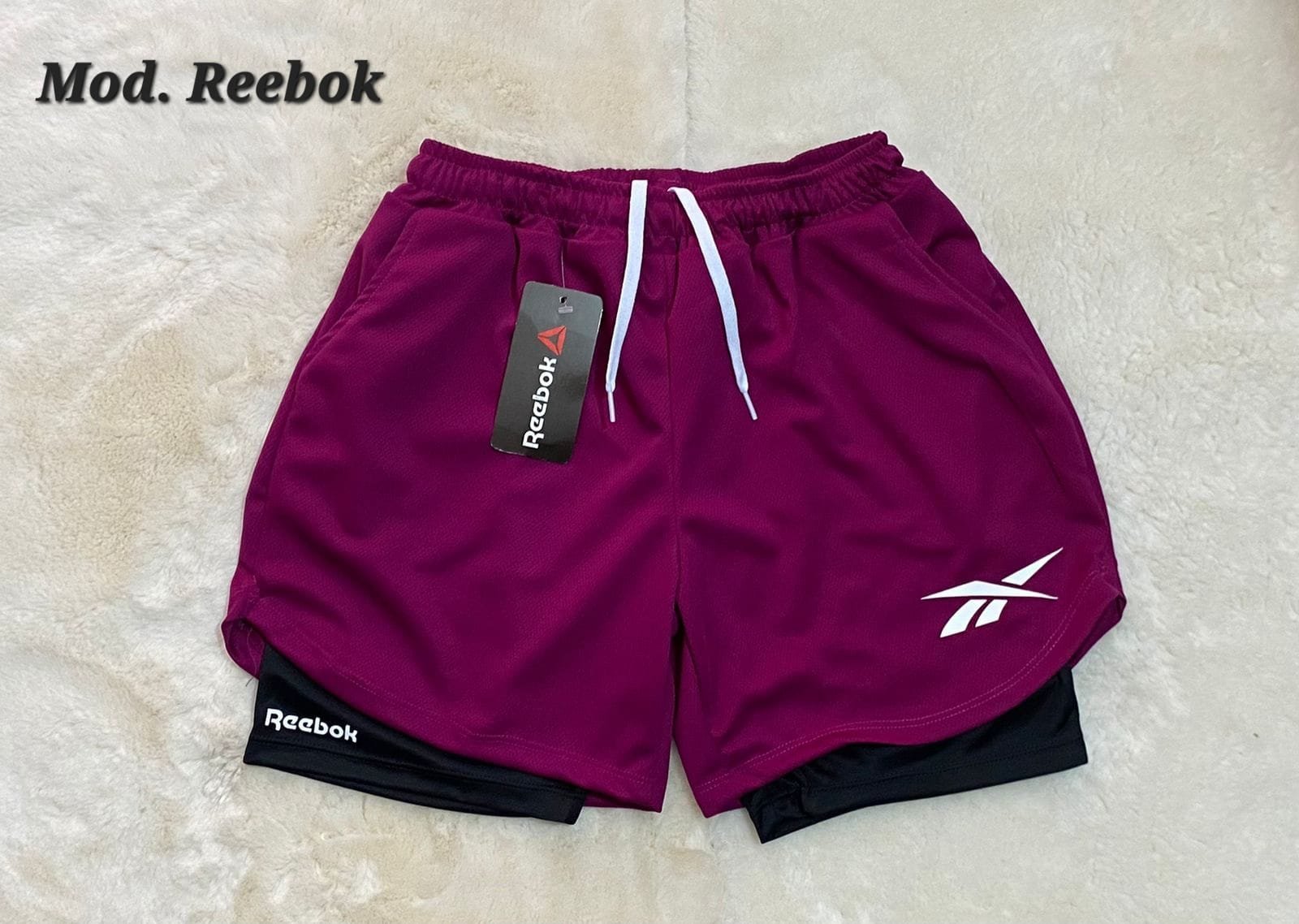 SHORT DEPORTIVO DAMA REEBOK MAGENTA.